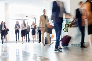 Blurred motion of business people walking in a facility